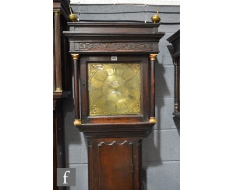 A oak cased thirty hour strike long case clock, brass dial marked Thomas Lister below blind fret work frieze and caddy top, d