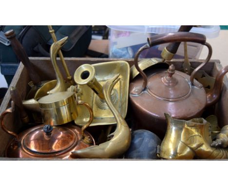 A collection of copper and brass items, to include teapots, scuttles and candlestick holders