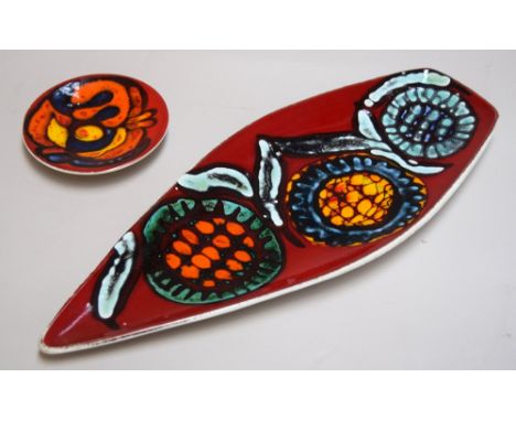 A Poole Pottery Delphis spear dish, shape number 82, decorated with stylised images of flowers on a bright red ground by Jane