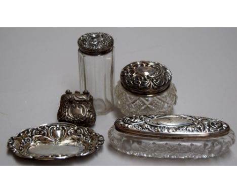 Two cut glass trinket boxes with sterling silver lids, a glass cylinder bottle with silver lid, a silver pin tray and a minia