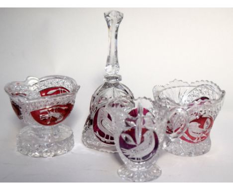 A set of four crystal glass items with ruby sections, two bowls, a cream jug and a bell, from the Hofbauer Collection