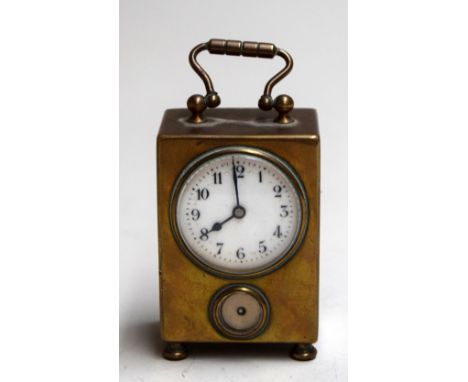A French brass cased miniature carriage clock with enamel dial and subsidiary dial backplate states 'movement sonnerie reveil