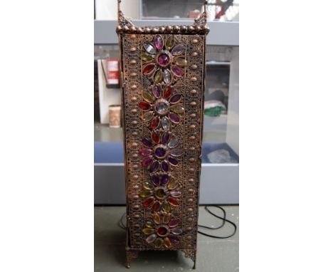 A Moroccan style floor lamp with jewelled flower head decoration