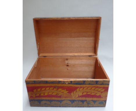 A red and black painted trunk from Jakarta, early 20th century with swirling carving, 40 x 59 x 35cmH