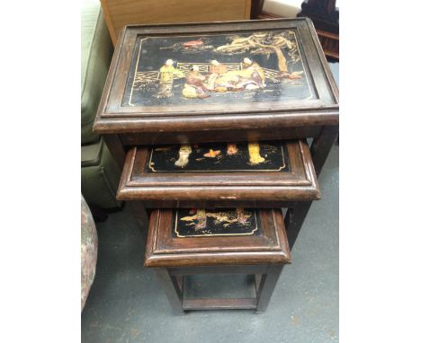A nest of three tables with scenes of Chinese women in the countryside, raised enamel and mother of pearl, the largest 57cmH