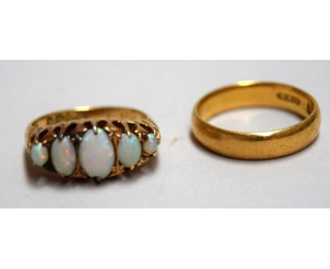 An 18ct gold opal five stone cluster ring, hallmarked G&G, and a 22ct wedding ring, William Wilkinson Ltd, 0.14oz