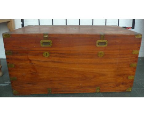 A vintage camphor wood travel trunk with metal bracing and side handles, 'C.K' carved into the top, 51 x 104 x 54cmH