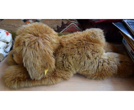 A cuddly dog by Steiff, with original label 52cmL