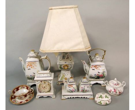 A collection of decorative Franklin Mint ceramics including a lamp base, a mantel clock, a tea pot and coffee pot, covered su