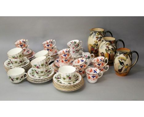 A set of three Royal Doulton graduated jugs from the Gleaners series, together with a collection of Royal Worcester Bacchanal