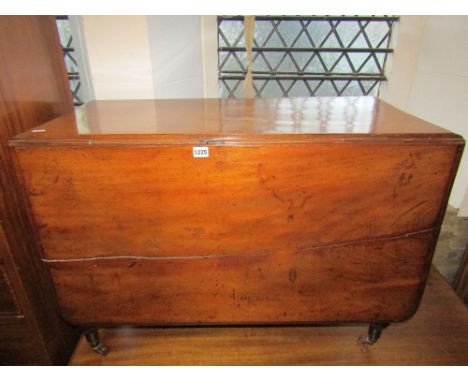 A 19th century mahogany drop leaf dining table of rectangular form with moulded outline raised on four turned and partially r