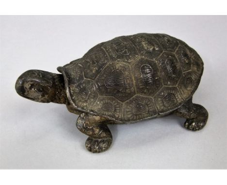 Gilt cast metal novelty inkwell in the form of a tortoiseshell with hinged lid shell enclosing a ceramic liner, 15cm long