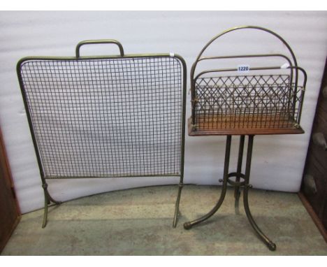 A Victorian brass floorstanding and revolving two divisional Canterbury with lattice divides and swept tripod supports togeth