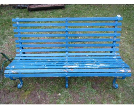 A vintage three seat garden bench with blue painted timber lathes, raised on sprung steel supports, 5ft long approx