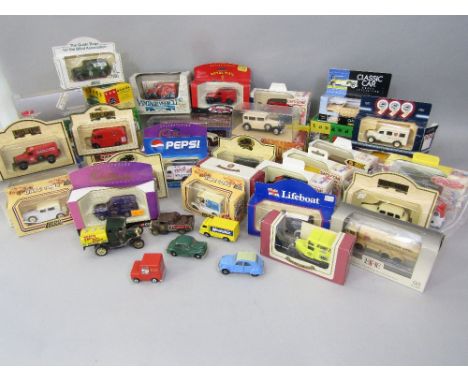 A box containing a large collection of die cast toys to include Corgi, Lladro and Days Gone