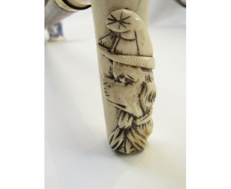 Walking stick with ivory handle, carved with a bust of a dog wearing a hat and scarf