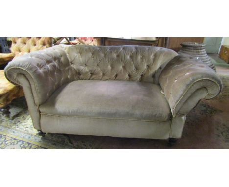 A Victorian Chesterfield sofa, later buttoned dralon finish and drop arm raised on turned supports to seat two, 160 cm wide