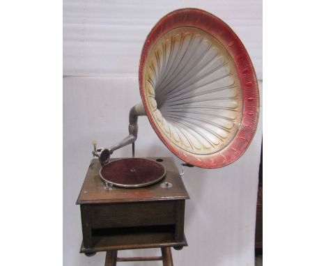 A vintage oak table top gramophone in oak, with painted horn and a King sound box
