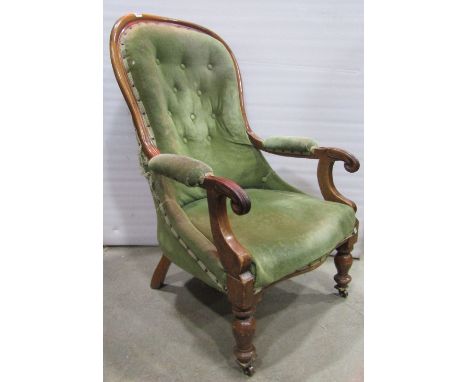 A Victorian spoonback drawing room chair with upholstered seat and button back within a showwood frame raised on turned forel