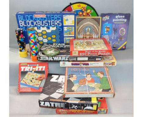 A box of vintage games and puzzles to include Guess Who, Star Wars Escape From Death Star, Blockbusters, etc