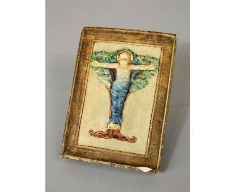 A Potter's Arts Guild, Compton Pottery, Guildford plaster plaque with tempered finish modelled as a swaddled Christ Child wit