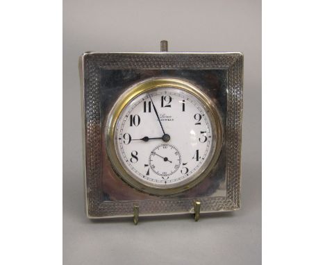 Early 20th century silver cased watch movement, the watch inscribed 'Lever 15 Jewels', with an engine turned silver frame dat