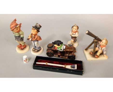 A model of a golly driving a vintage style car, with printed mark to base Carlton ware and painted mark Trial, 12cm long appr