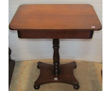 An unsual Victorian mahogany occasional table of rectangular form fitted with two drawers (one either end) raised on a centra