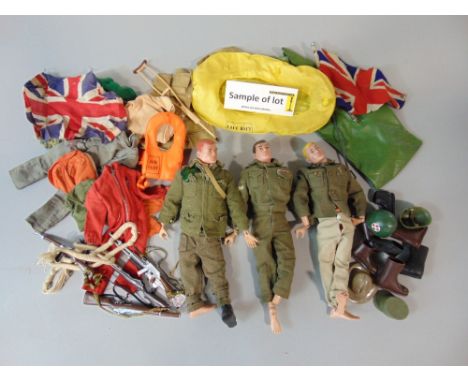  A collection of vintage Action Man dolls, clothes, weapons, accessories etc