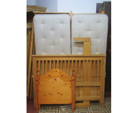A contemporary light oak 5ft bedstead, to accept 4ft 6 mattress, with panelled head and foot boards, together with a similar 