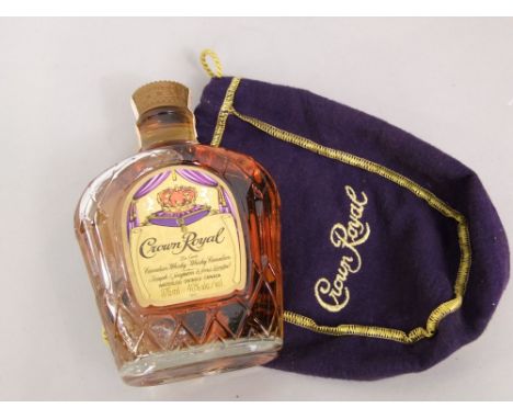 Vintage bottle of Crown Royal Whiskey, with purple baise pouch