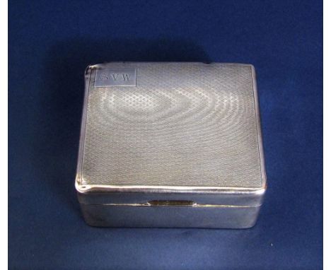 1920s silver engine turned cigarette box, the hinged lid enclosing a cedar lined interior, 10.5cm wide 