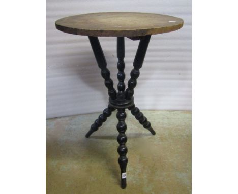 A traditional gypsy table, the circular top raised on six turned bobbin supports 