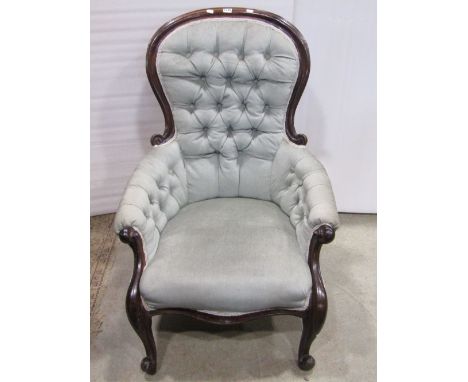 A mid Victorian mahogany framed drawing room chair, the showwood frame raised on cabriole supports, with button back finish 