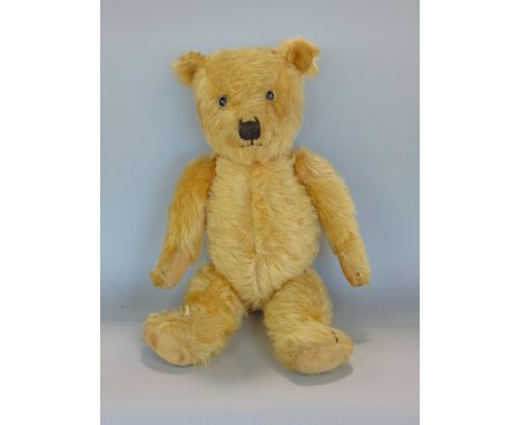 1940s Chiltern teddy bear, 19" tall, with glass eyes, stitched nose, mouth and claws, jointed limbs, cloth paw pads