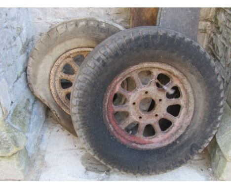 A pair of old tractor/agricultural wheels with iron hubs and rubber tyres (AF)
