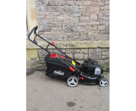 A Florabest petrol driven cylinder lawn mower, with Briggs and Stratton 450E series engine, complete with grass collection bo