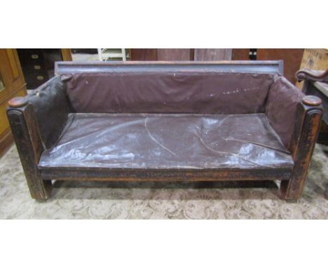 A novel substantial three to four seat sofa, the framework constructed from a Victorian half tester bedstead