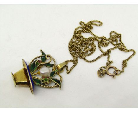 A contemporary plique-a-jour enamel pendant modelled as a basket of flowers set with a central cultured pearl, in silver gilt