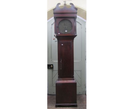 A Georgian mahogany longcase clock, the hood with Corinthian columns beneath a swan neck cornice, enclosing a circular brass 