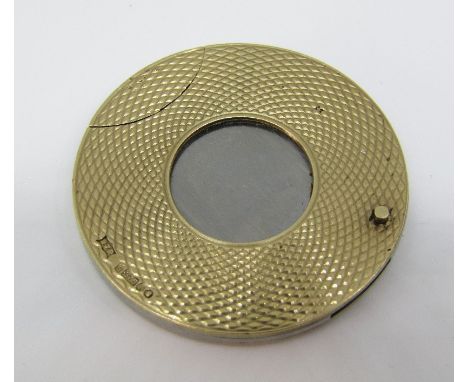A 9ct engine turned cigar cutter of circular form, 3.5cm diameter approx