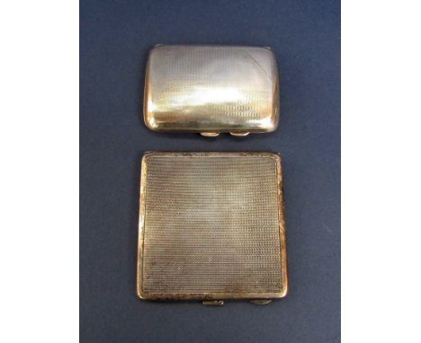 Two engine turned silver cigarette cases, 5oz approx