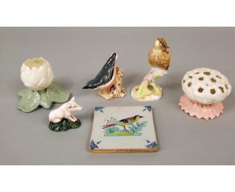 A Royal Doulton figure of a seated piglet HN2652, a Grainger &amp; Co Worcester hat pin holder in the form of a flower head w