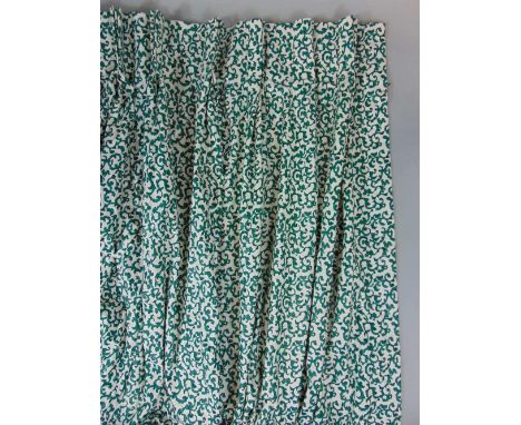 Single curtain in a bright green and white print, lined, with fixed width triple pleat heading 1.8 m, lower hem width 4 m and