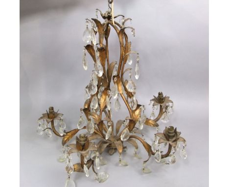 Two gilt metal ceiling lights to include a five branch chandelier type lamp with inter woven leaf decoration and prismatic dr