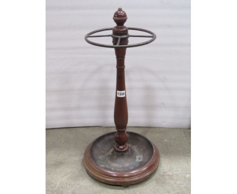 A Victorian style mahogany stick stand, the circular drip tray metal lined