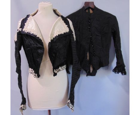 Victorian ladies black jacket with stayed bodice and ivory silk embellishments at the collar, hem, cuffs and over the shoulde