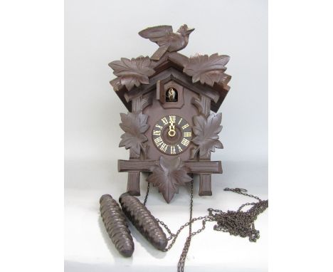 Mid-20th century oak cased cuckoo clock, two weights and pendulum