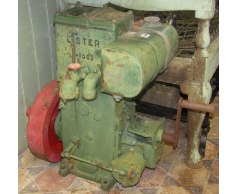 A Lister stationery engine, serial number 1-1062, fuel driven with crank handle start