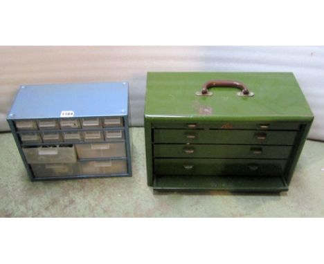 A vintage green painted steel portable engineers tool cabinet with removable front enclosing four shallow drawers and content